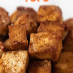 Close-up shot of a bowl of air fryer tofu with the words air fryer tofu