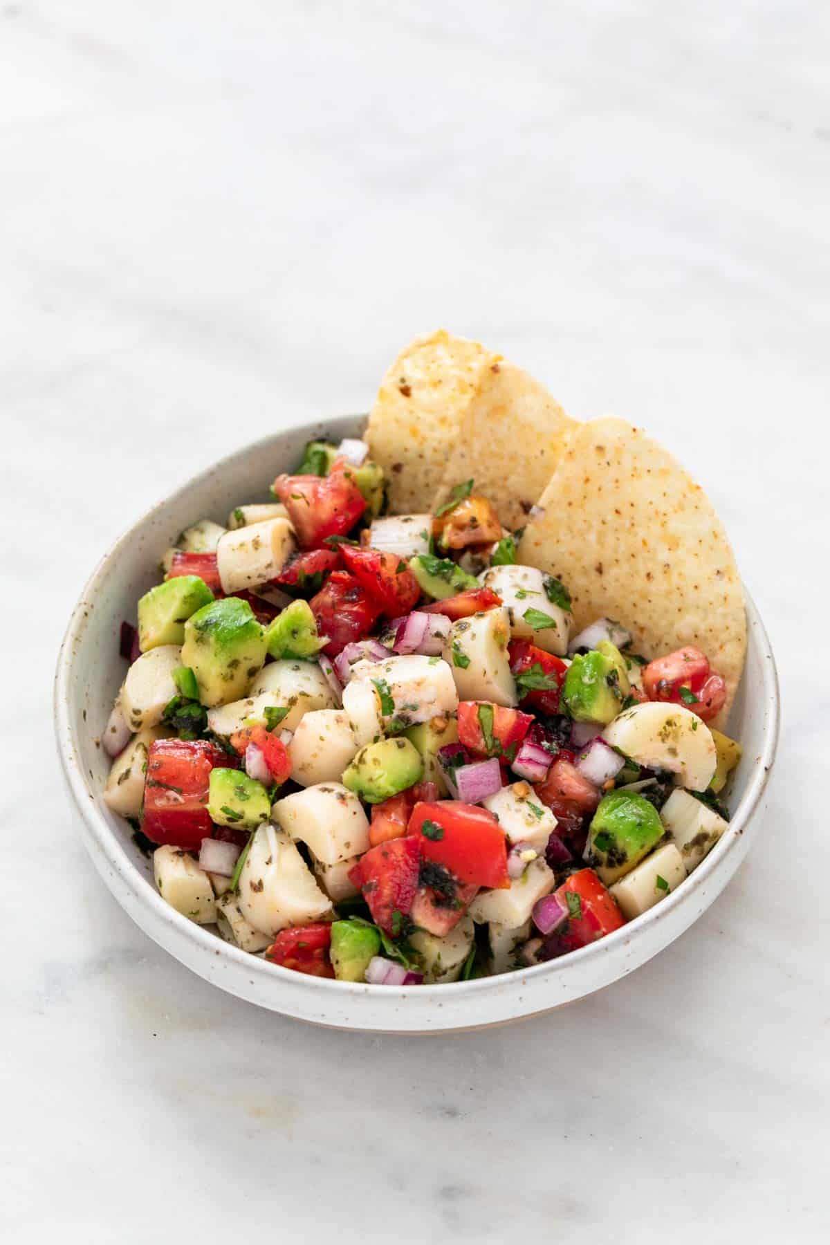 Vegan ceviche in a bowl with tortilla chips.