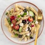 Vegan pasta salad on a plate with a fork.
