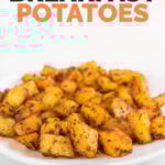Side shot of a plate of breakfast potatoes with the words breakfast potatoes