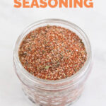 Photo of a small jar with homemade Cajun seasoning with a heading