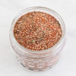 Square photo of a small jar with homemade Cajun seasoning