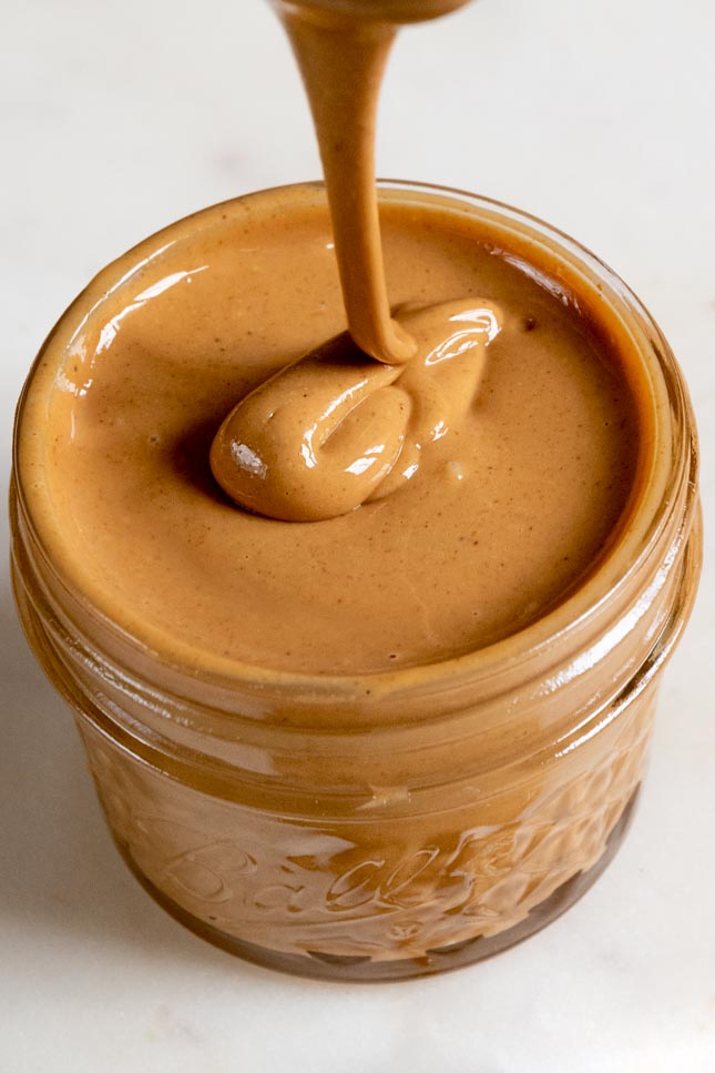 A close picture of a jar with homemade cashew butter