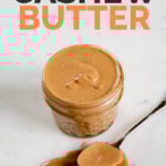 A picture of a jar and a spoon with cashew butter and the words cashew butter