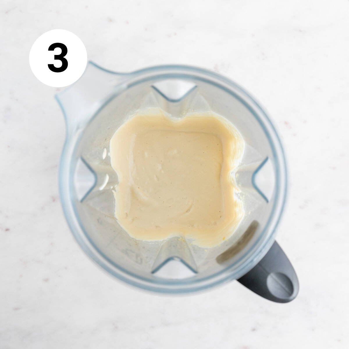 Vegan cashew cheese in a blender jar.