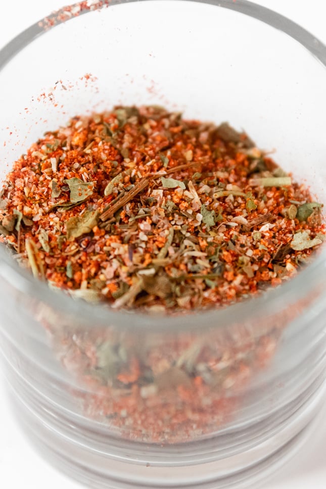 Close-up shot of a glass jar or chicken seasoning