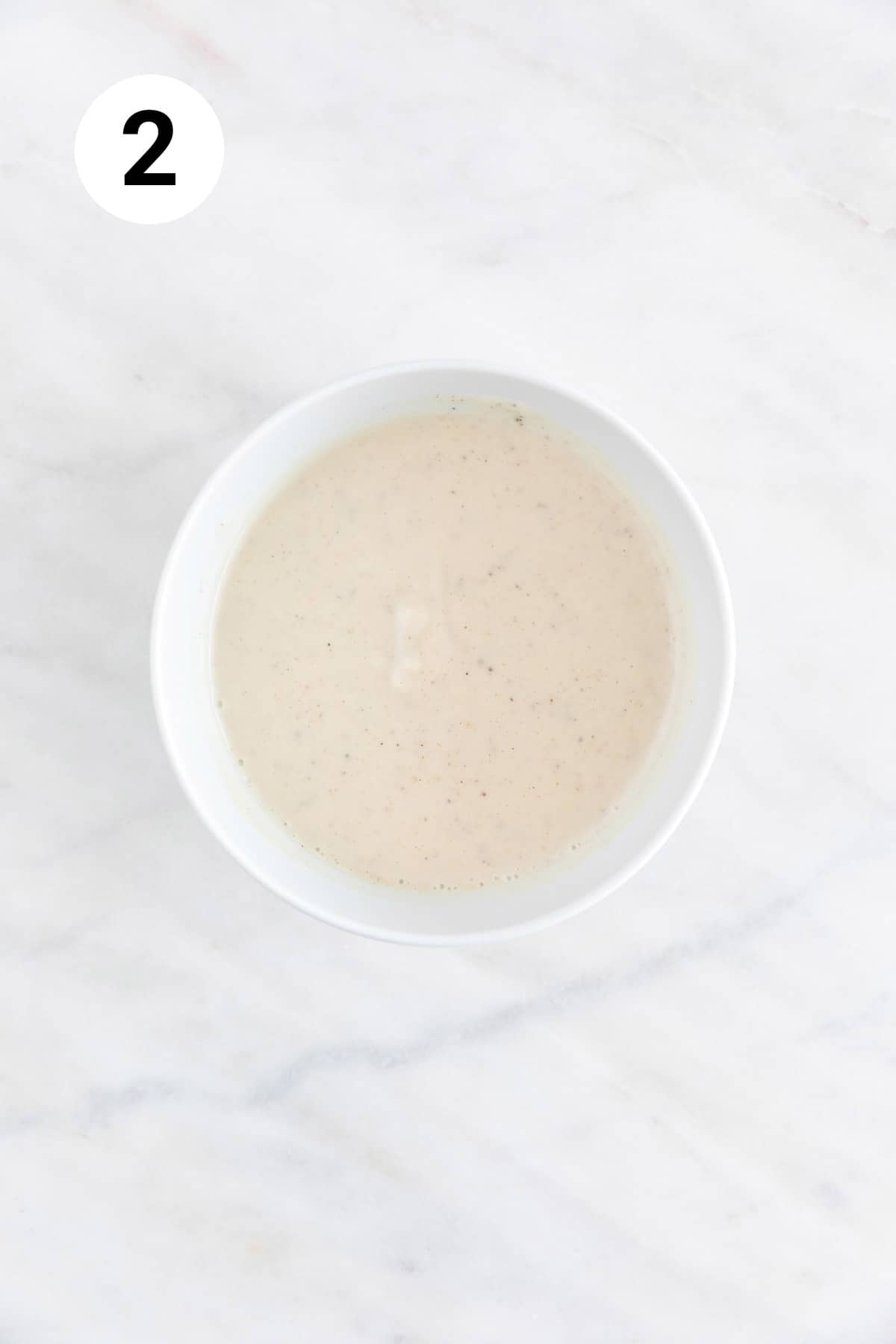 Vegan coleslaw dressing in a small bowl.