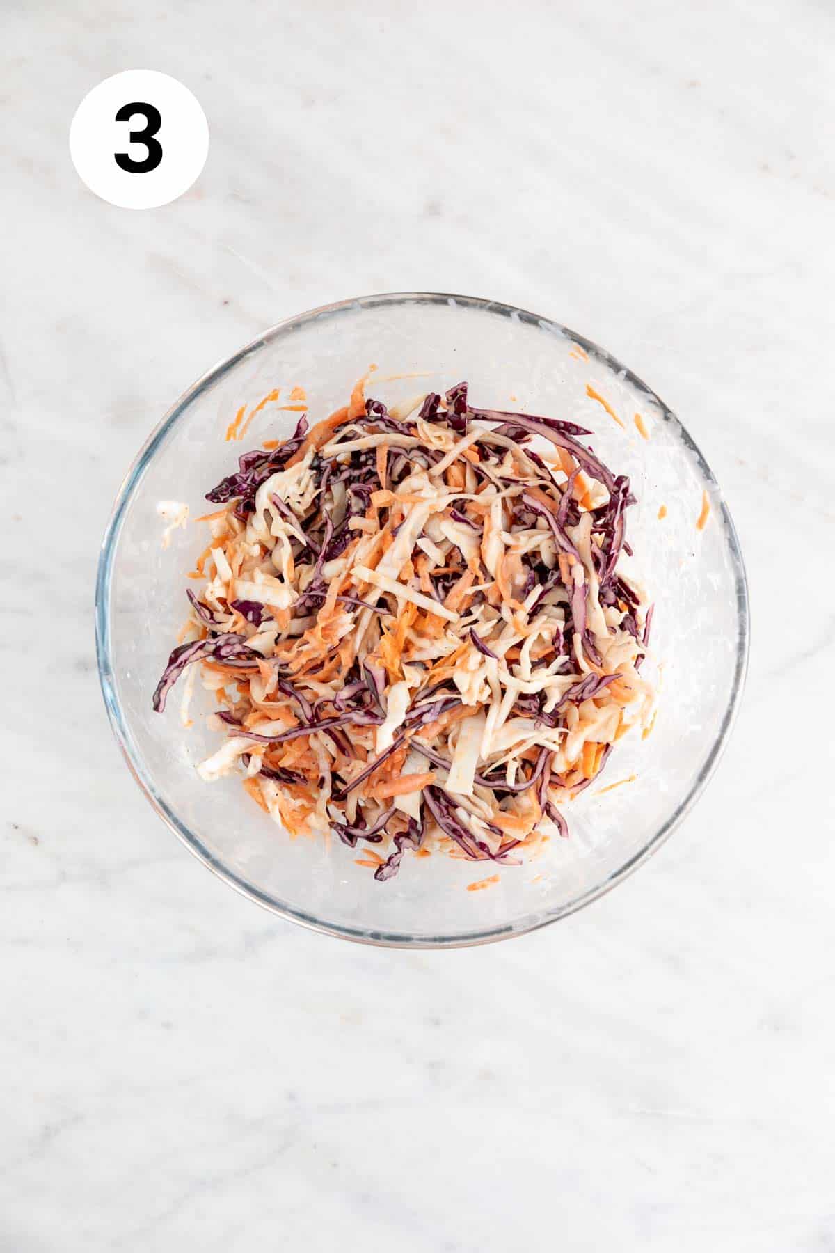 Vegan coleslaw in a large mixing bowl.