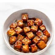 Sesame tofu served in a dish.