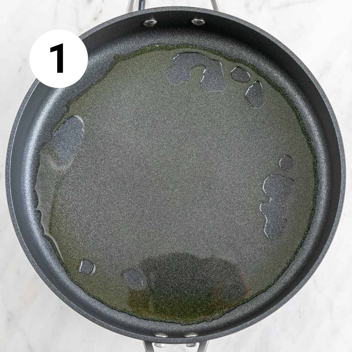 Skillet with extra virgin olive oil.