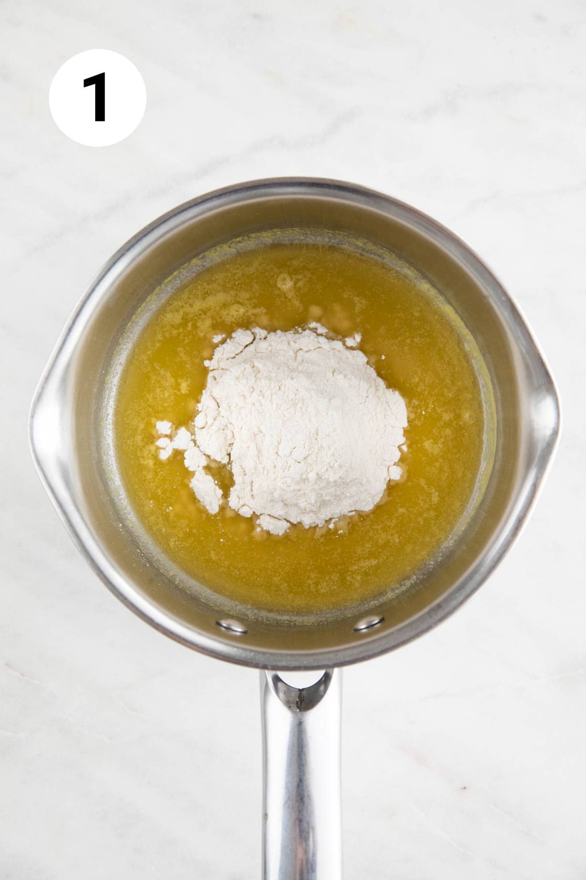 Saucepan with melted vegan butter and all-purpose flour.