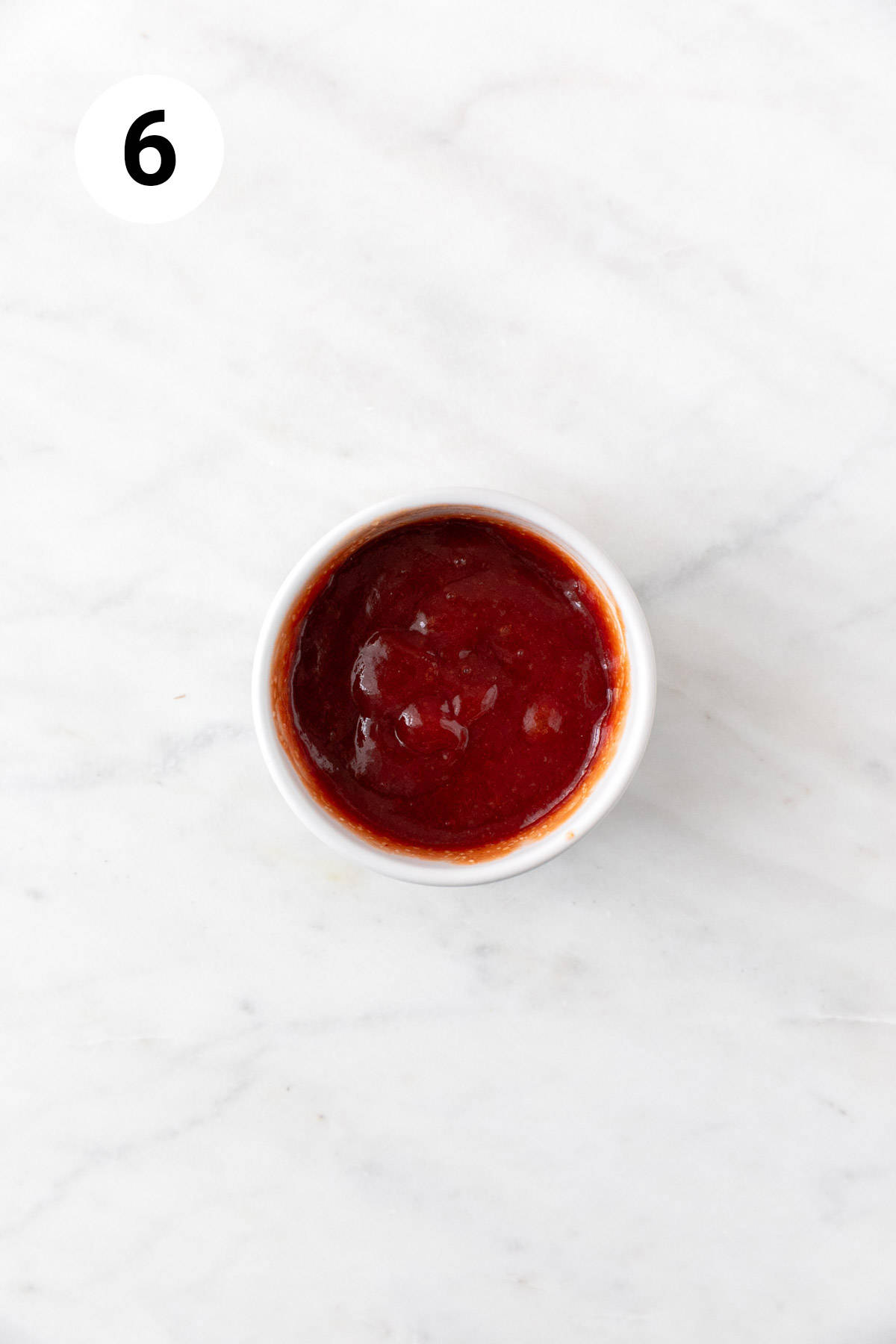 The glaze in a small mixing bowl.