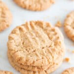 Three vegan peanut butter cookies stacked up.