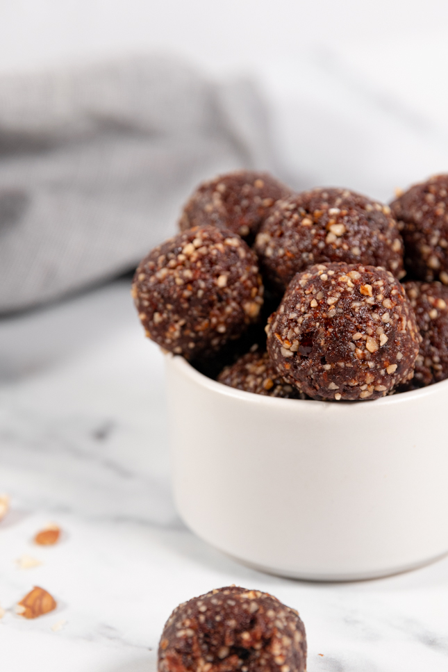 Close-up shot of a bowl with some energy balls in it
