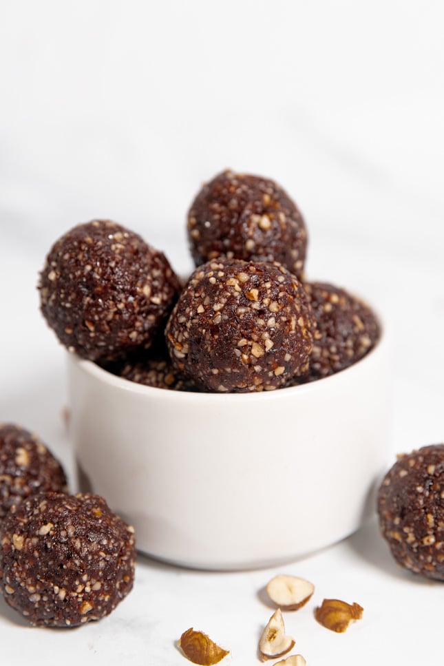 Side shot of a bowl with some energy balls in it