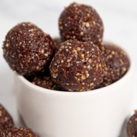 Square photo of a bowl with some energy balls in it