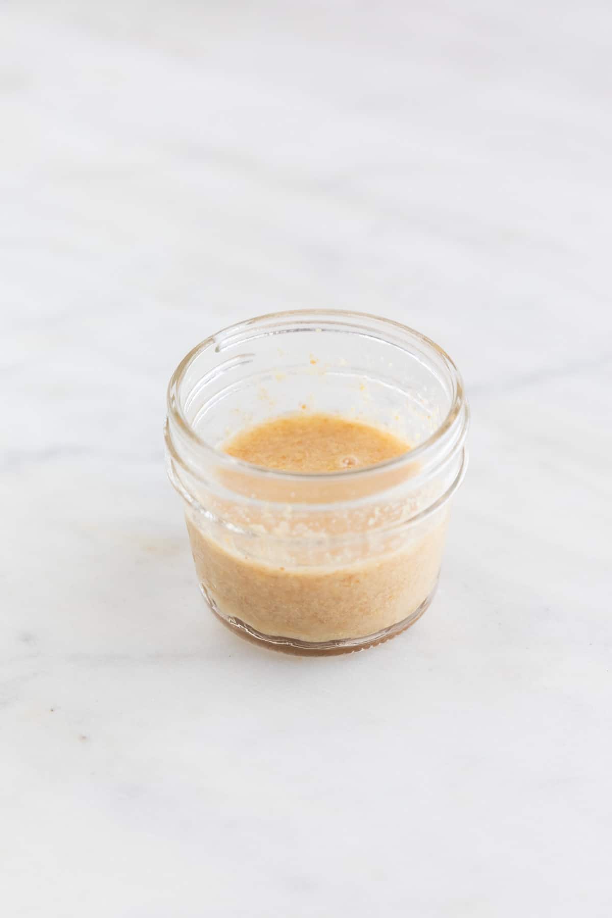 The water and flaxseed meal mixed in a small container after thickening.