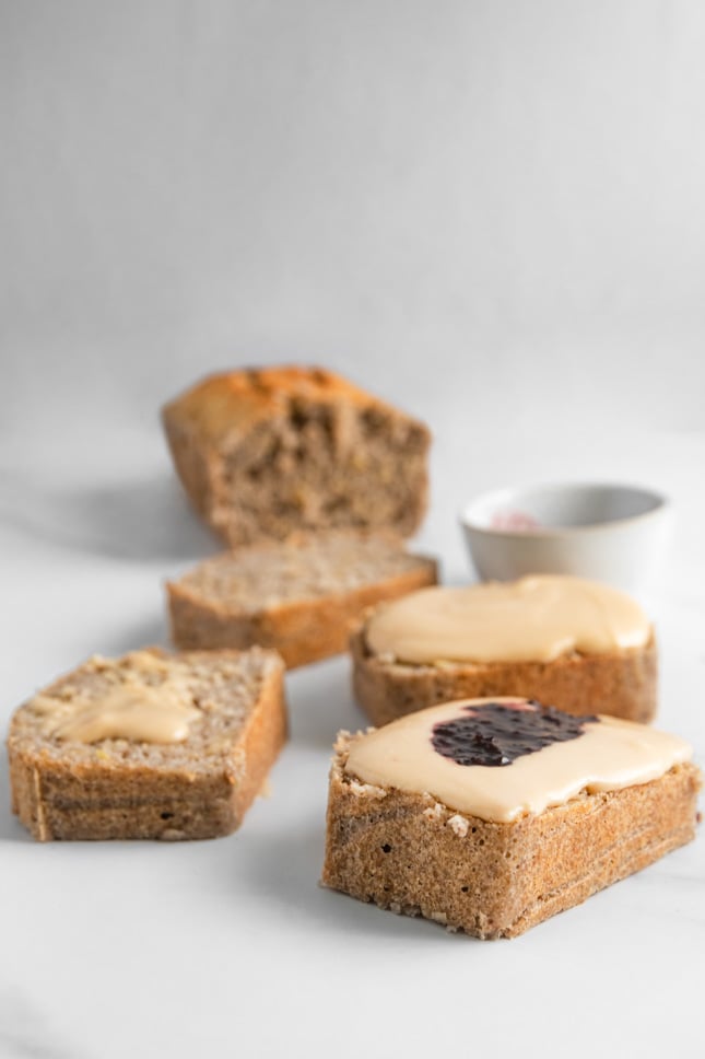Photo of some slices of gluten-free bread with peanut butter and jelly on top