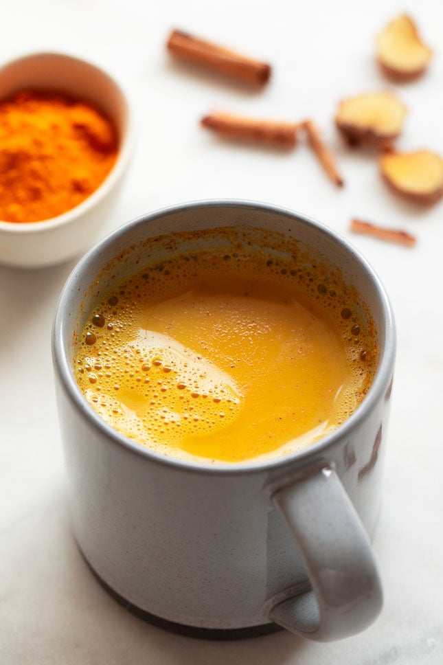 Photo of a mug with golden milk on the inside