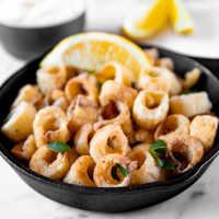 Square photo of a bowl of hearts of palm calamari