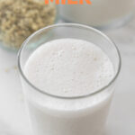 Photo of a glass of hemp milk with the words hemp milk