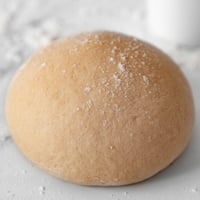 Square photo of a homemade pizza dough