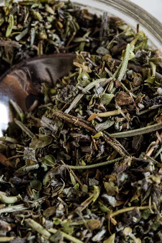 A close shot of a jar with homemade Italian seasoning