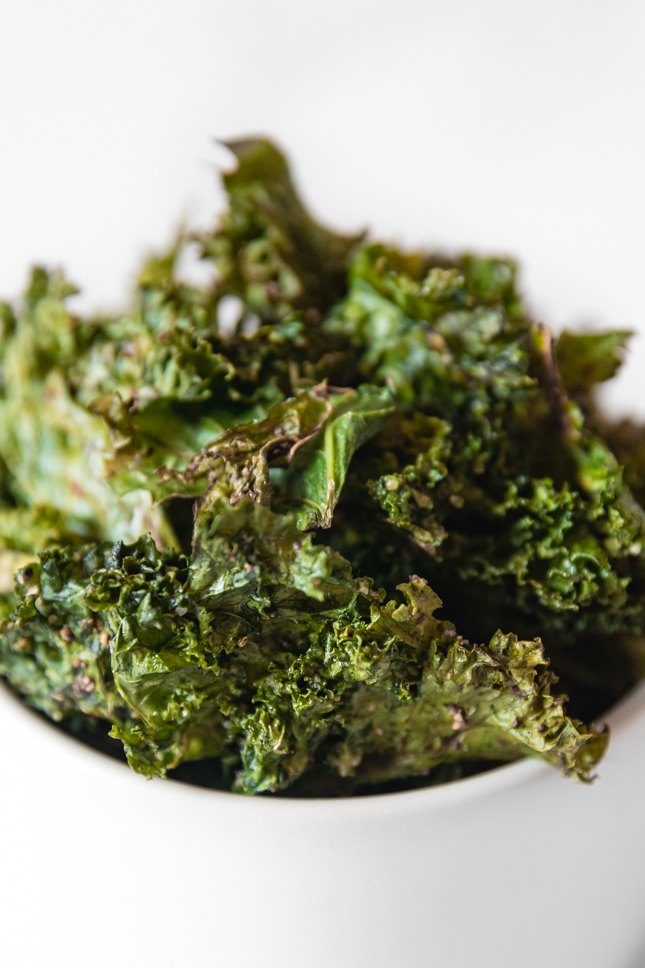 Close-up shot of a bowl of kale chips