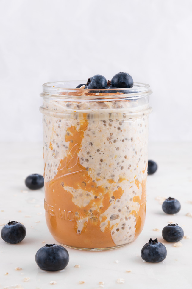 Side shot of a glass jar of overnight oats