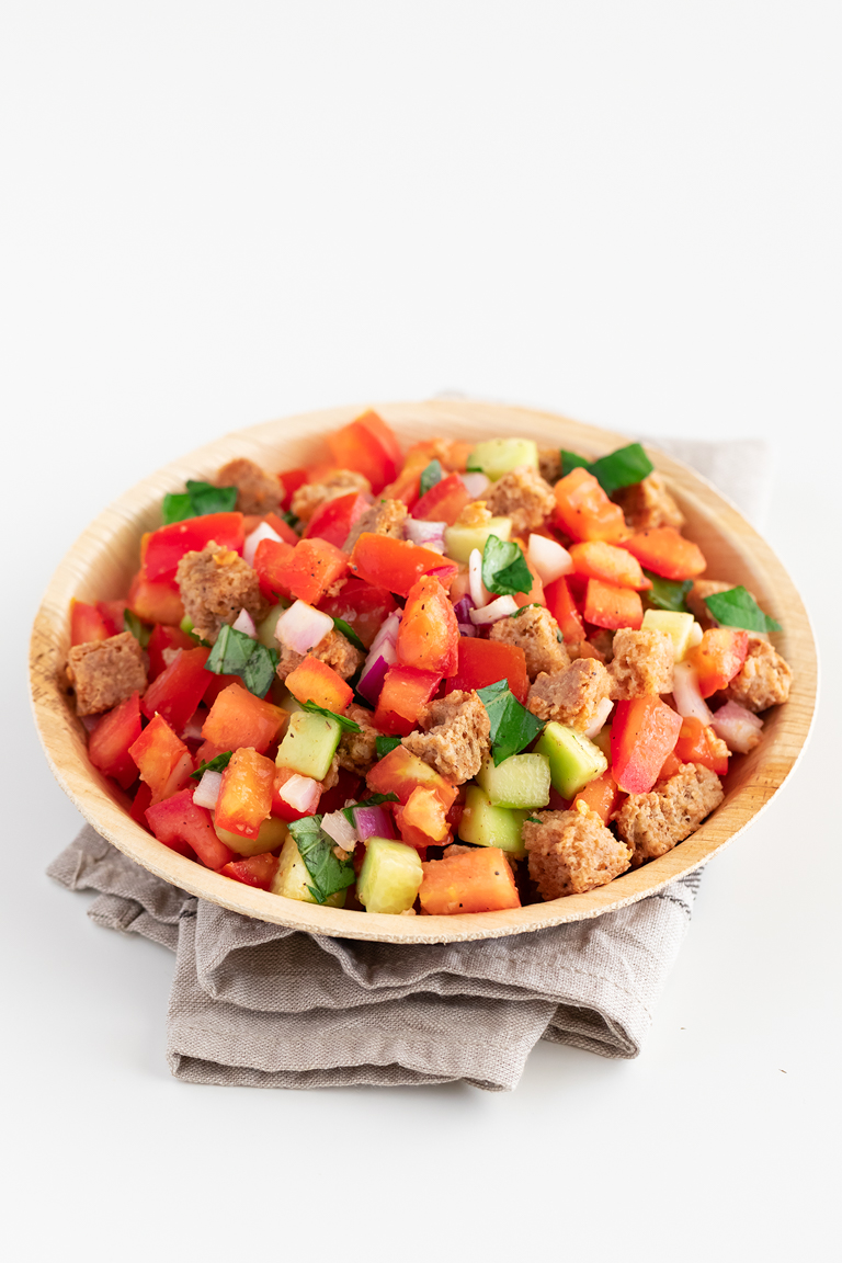 Panzanella Salad. - Panzanella is an Italian tomato and bread salad, popular in Tuscany and other parts of central Italy. It only requires 9 ingredients and 15 minutes. #vegan #simpleveganblog