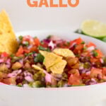 Side close-up shot of a bowl of pico de gallo with the words pico de gallo