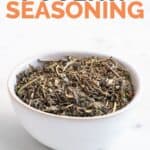 Photo of a bowl of poultry seasoning with the words poultry seasoning on top
