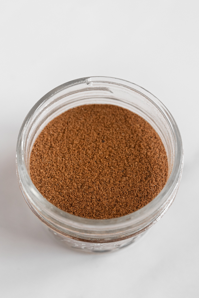 Close-up shot of a glass jar of pumpkin pie spice