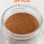 Photo of a glass jar of pumpkin pie spice with the words pumpkin pie spice