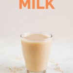 A side shot of a glass with brown rice milk made from scratch with the words rice milk