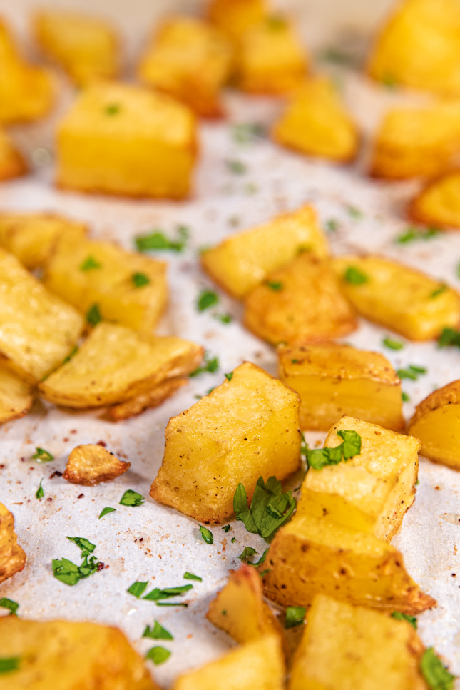 Close-up shot of a plate of roasted potatoes