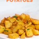 Side shot of a plate of roasted potatoes with the words roasted potatoes