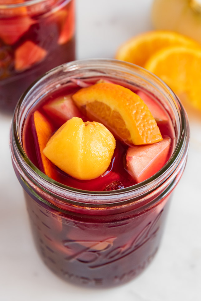 Close-up shot of a glass jar of sangria