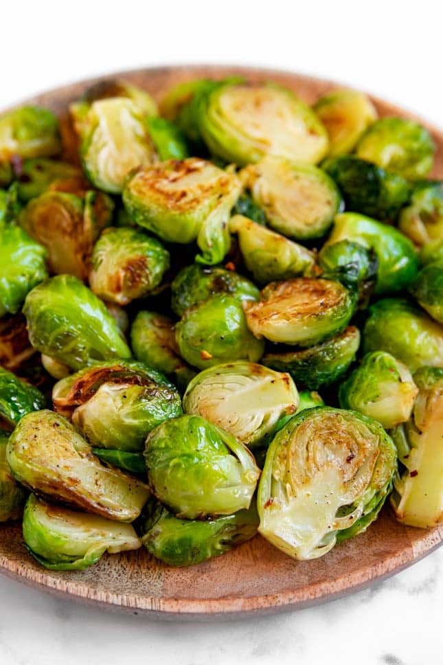 Close-up shot of a plate of sauteed Brussels sprouts