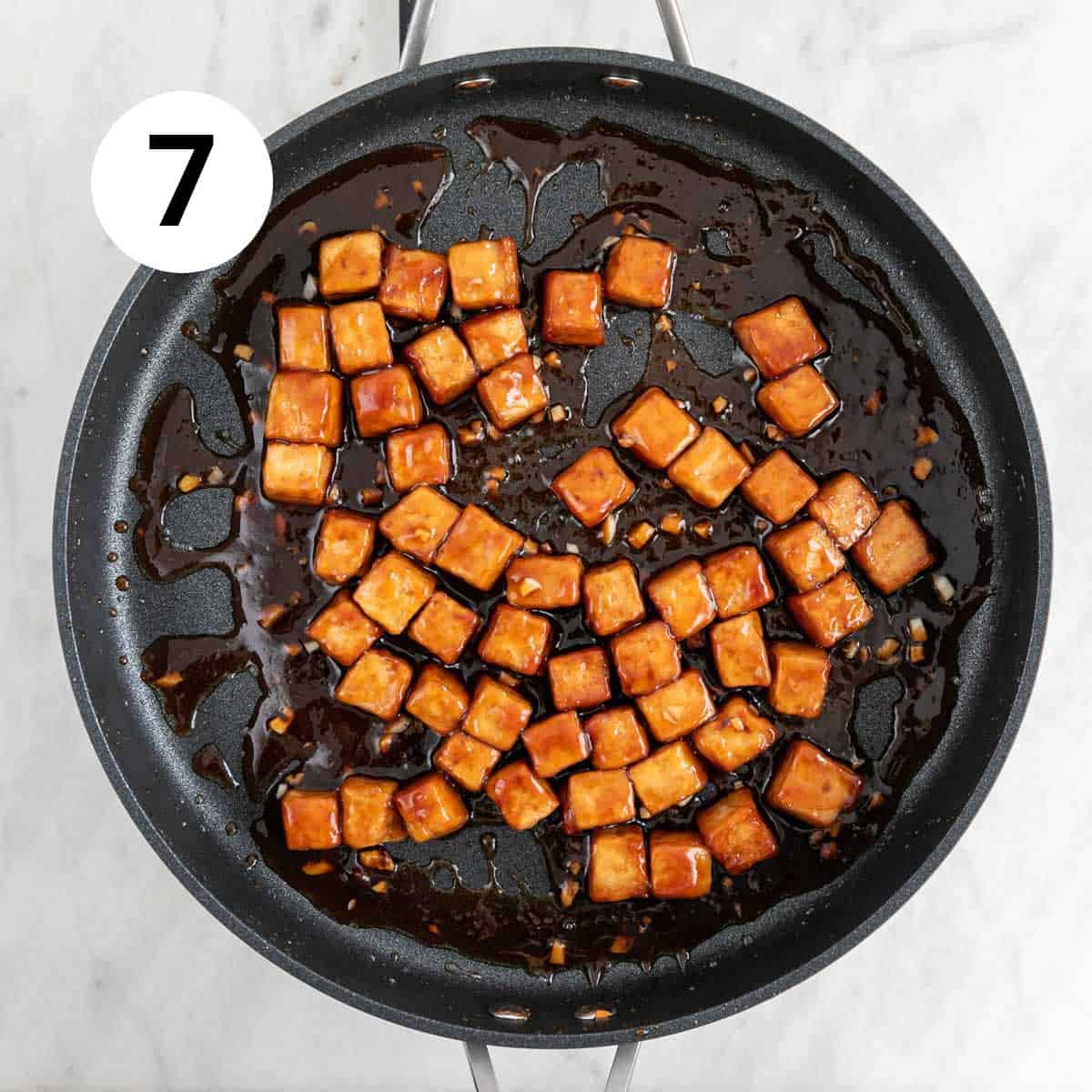 Sesame tofu cooked in a skillet.
