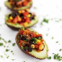 Square photo of 3 stuffed avocados