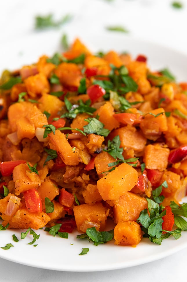Close-up shot of a plate of sweet potato hash