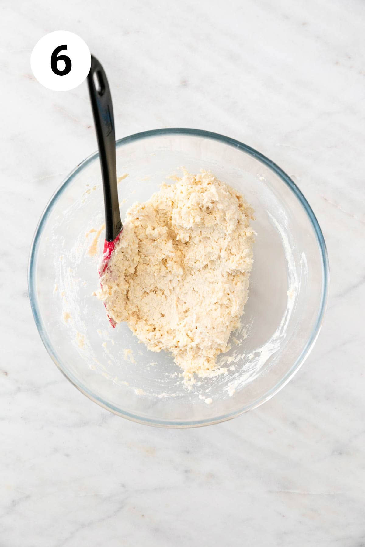Vegan biscuits dough in a large mixing bowl.