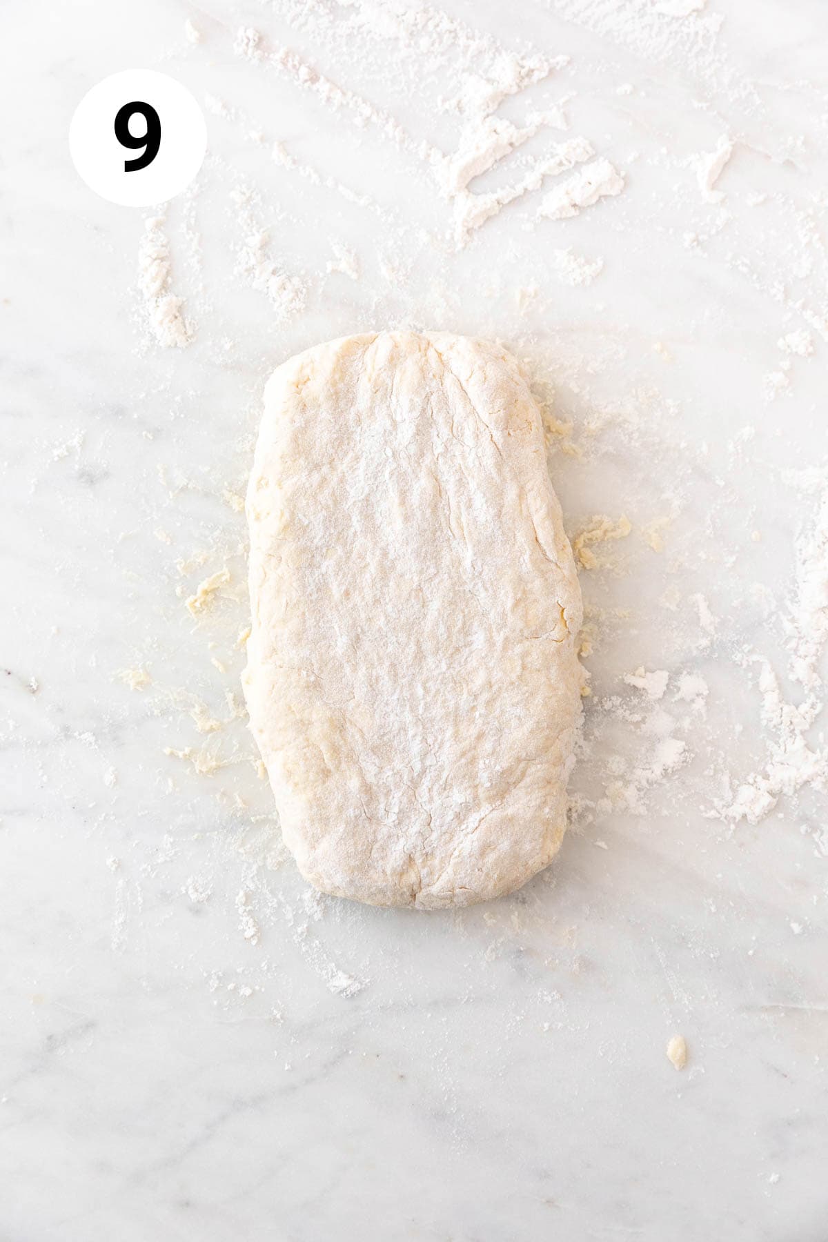 The dough, after folding one side into the center, followed by the other side.