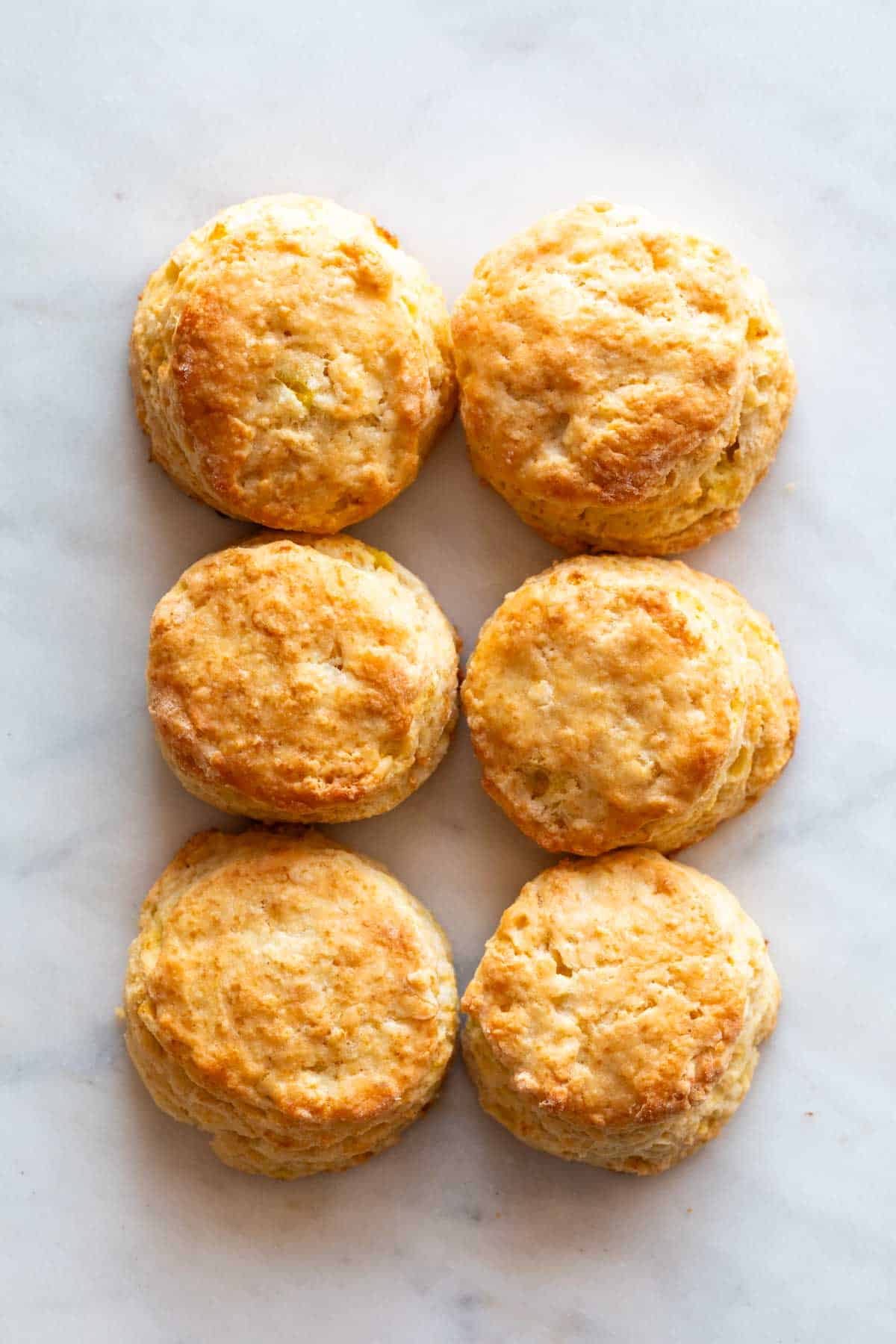 Six vegan biscuits on a marble background.