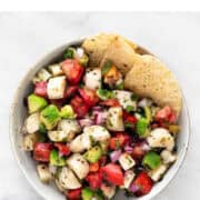 Bowl with vegan ceviche and tortilla chips.