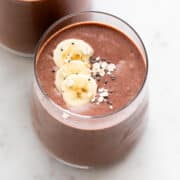Two glasses holding dairy-free protein shake.