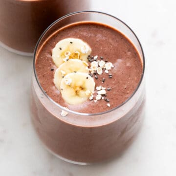 Two glasses holding dairy-free protein shake.