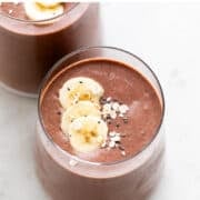 Two glasses filled with vegan protein shake.