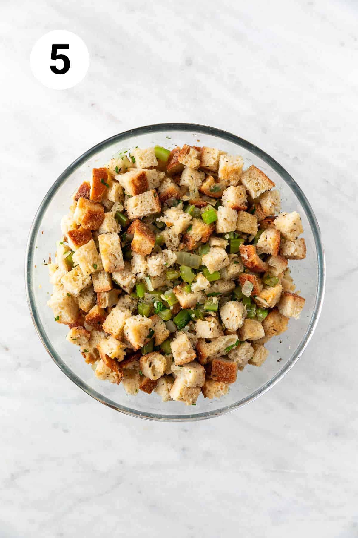 Vegan stuffing in a bowl before baking.